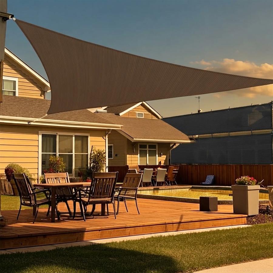 Triangle sun shade sail over a garden seating area